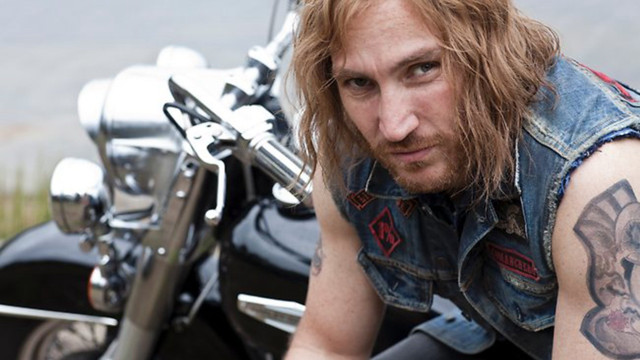 Man tattoo motorcycle bear leaning free wallpaper - medium preview image