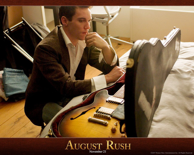 Man sitting bed guitar lap free wallpaper - medium preview image