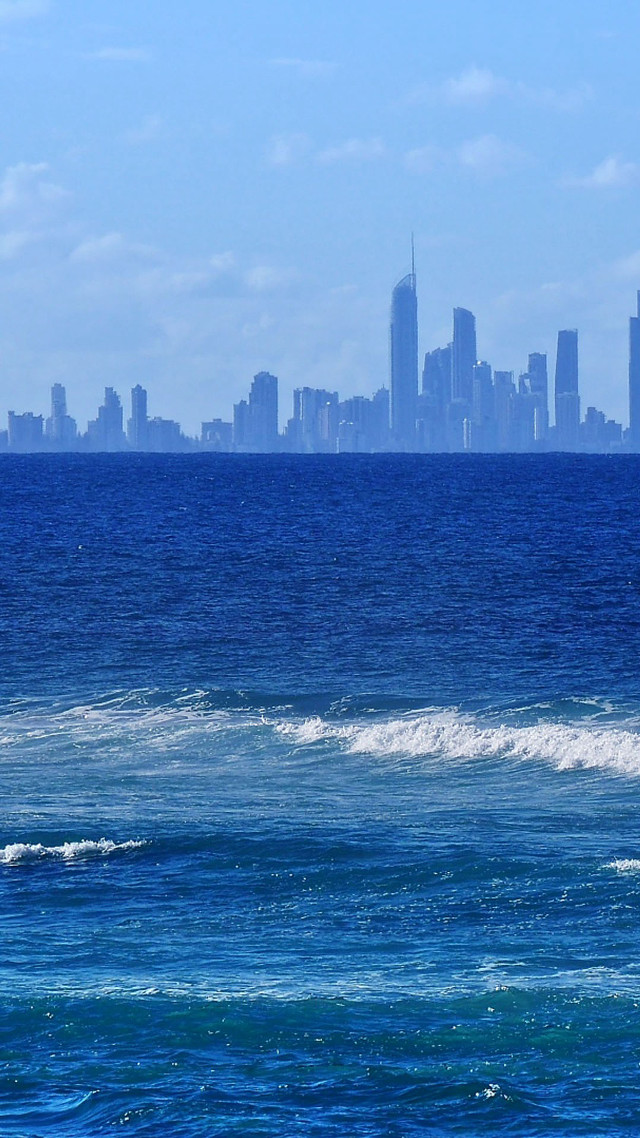 Man surfboard wave ocean city free wallpaper - medium preview image