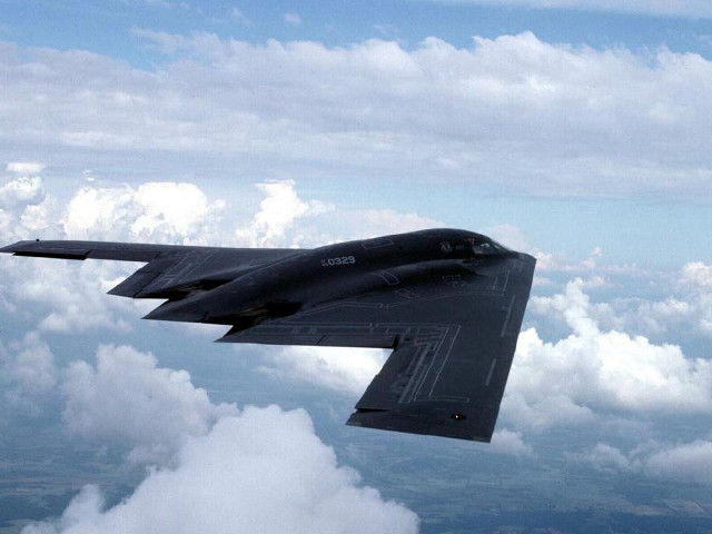 Jet flying cloud filled sky free wallpaper - medium preview image
