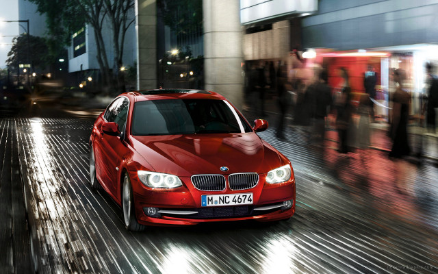 Red car night crowd sidewalk free wallpaper - medium preview image