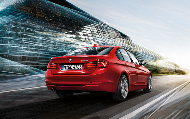 Red car driving street tall #2 free wallpaper - medium preview image
