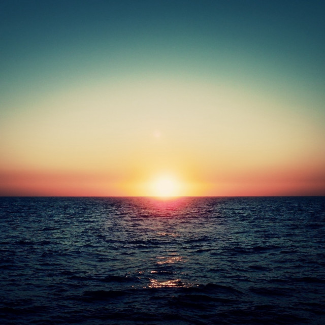 Sunset ocean boat person shore #2 free wallpaper - medium preview image