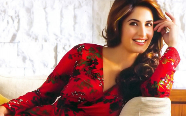 Woman red dress couch smiling free wallpaper - medium preview image