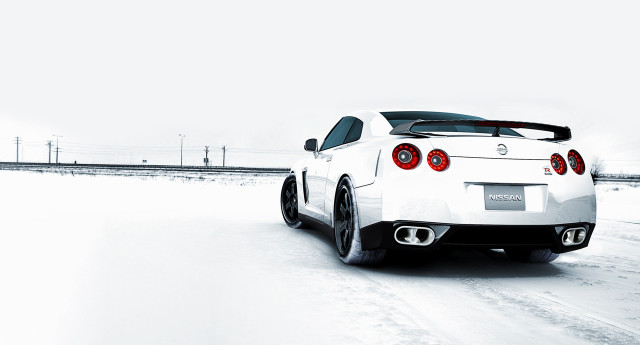 White sports car snowy road #2 free wallpaper for desktop - medium preview image