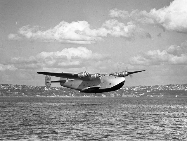 Plane flying water cloudy sky free wallpaper - medium preview image
