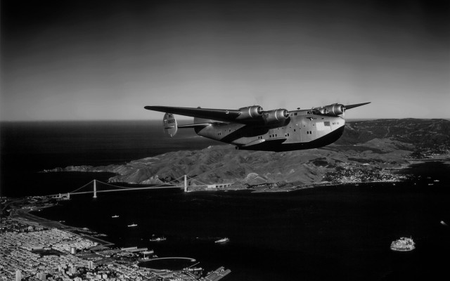 Airplane flying water mountains bridge free wallpaper - medium preview image
