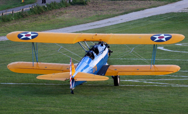 Small yellow airplane grass road free wallpaper - medium preview image