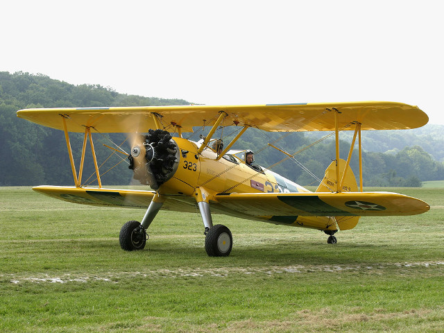 Yellow airplane propeller grass field free wallpaper - medium preview image