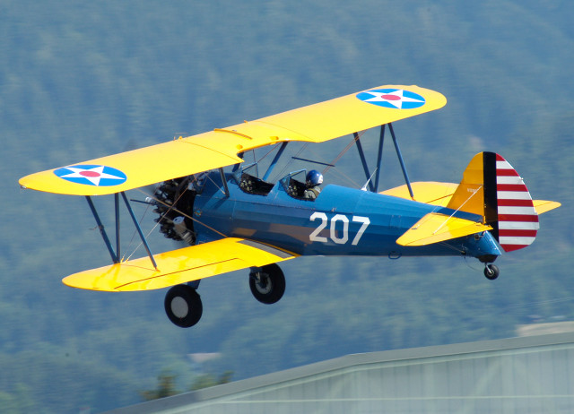 Small blue yellow airplane mountain free wallpaper - medium preview image