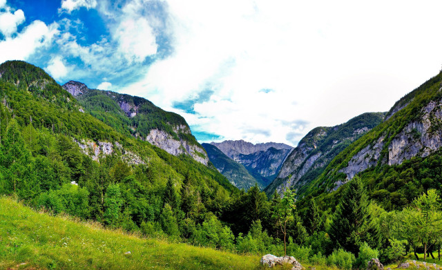 Valley mountains clouds grassy field free wallpaper - medium preview image