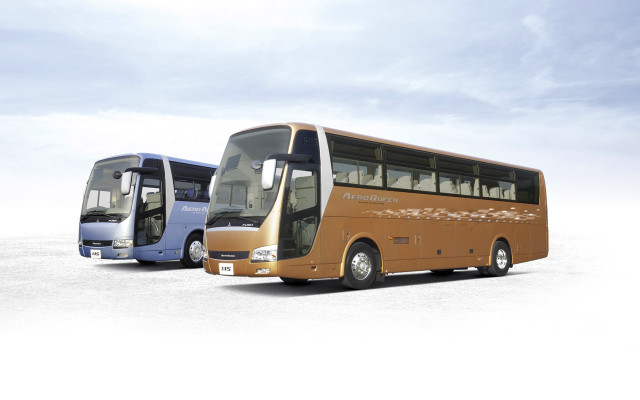 Buses parked snowy surface sky free wallpaper - medium preview image