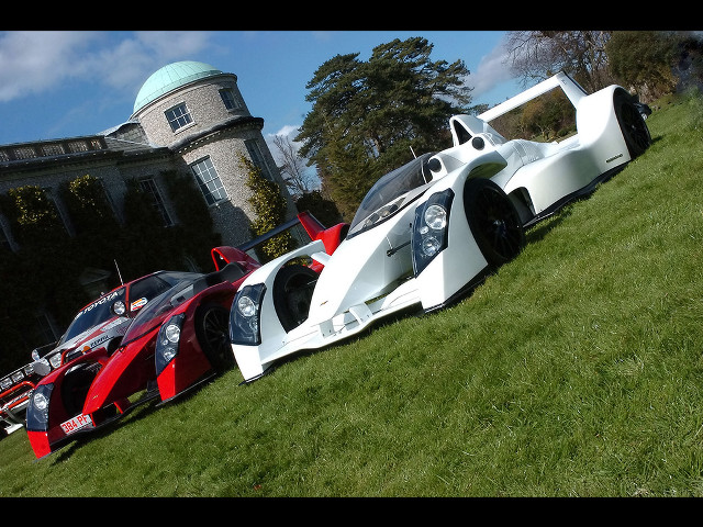 Cars parked lush green field free wallpaper - medium preview image