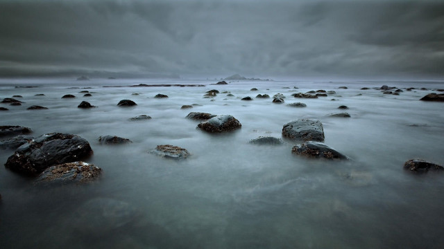 Rocks beach cloudy sky background free wallpaper - medium preview image