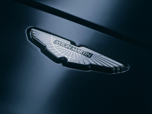 Car badge closeup dark room free wallpaper - medium preview image