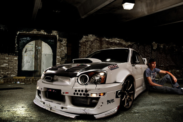 Man sitting ground white car free wallpaper - medium preview image