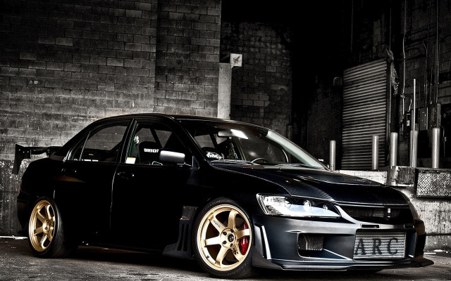 Black car brick building gold free wallpaper - medium preview image
