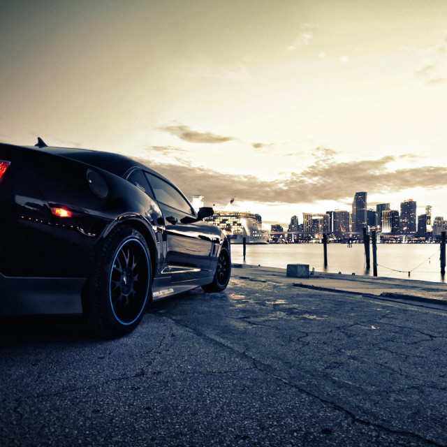 Black sports car water city free wallpaper - medium preview image
