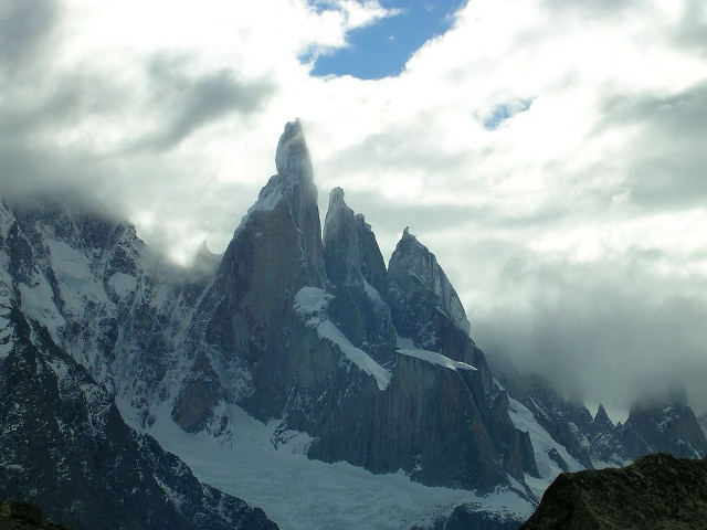 Snowy mountain clouds rocks ground free wallpaper - medium preview image