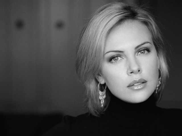 Blond hair serious woman earrings free wallpaper - medium preview image