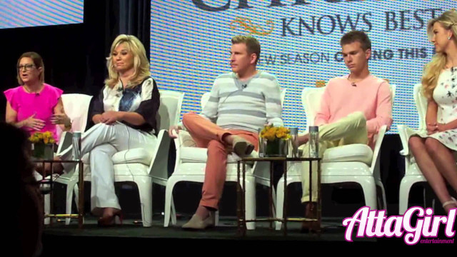 Group people white chairs stage free wallpaper - medium preview image