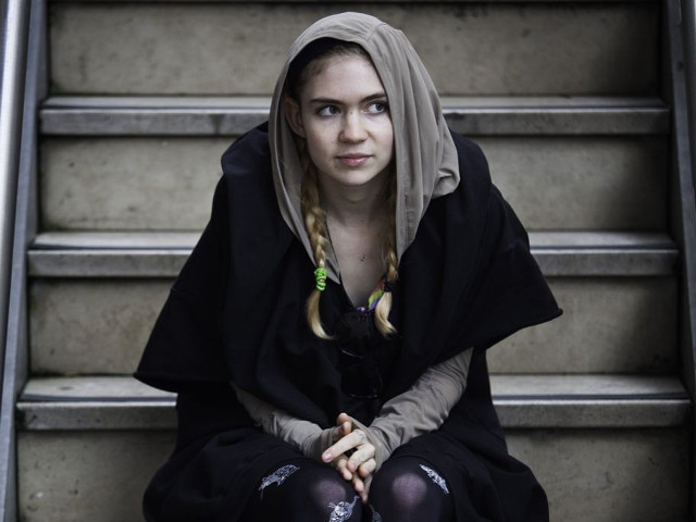 Woman sitting stairs black outfit free wallpaper - medium preview image