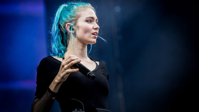 Woman blue hair microphone looking free wallpaper - medium preview image