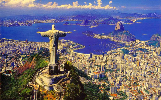 Christ statue overlooking city ocean free wallpaper for desktop - medium preview image