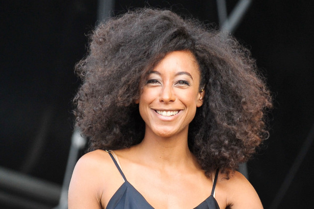 Woman afro smiling stage microphone free wallpaper - medium preview image