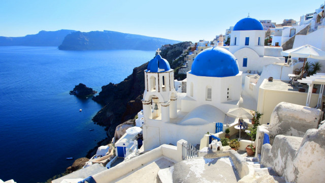 Blue white building cliffside ocean free wallpaper - medium preview image