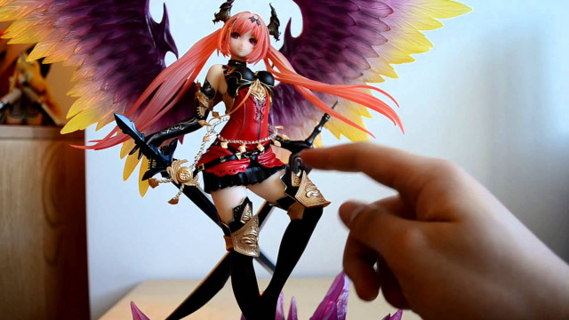 Hand holding toy doll figure free wallpaper - medium preview image