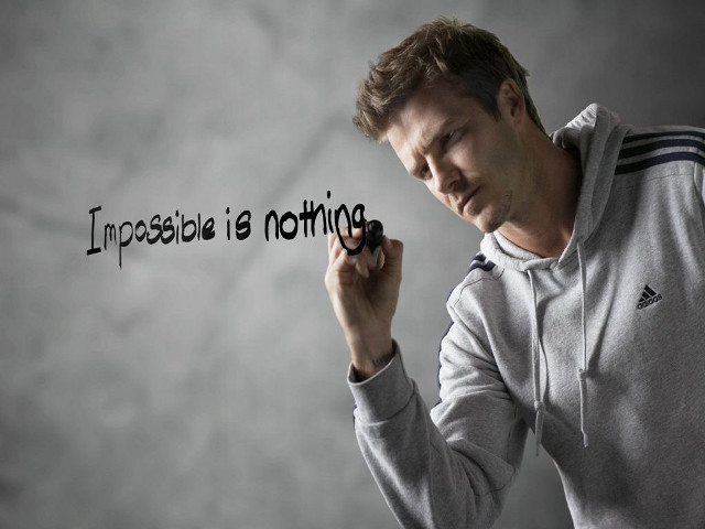 Man holding marker impossible is free wallpaper - medium preview image