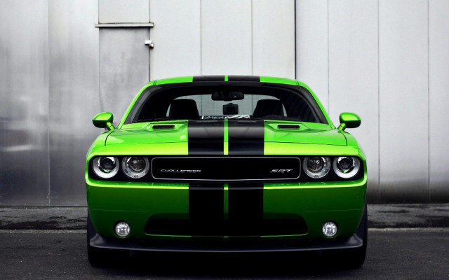 Green black car parked building free wallpaper - medium preview image
