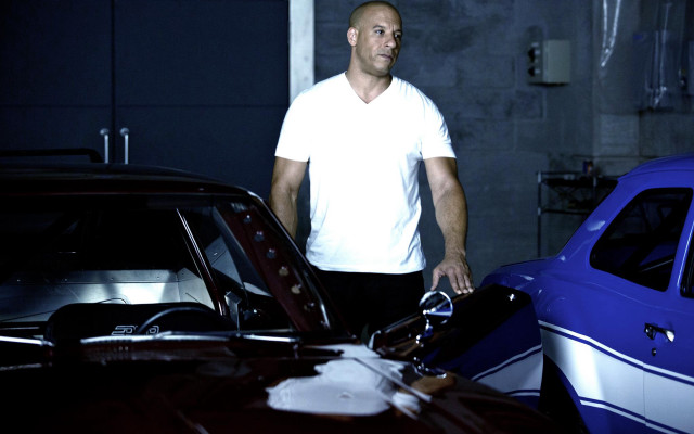 Man standing car garage background free wallpaper - medium preview image