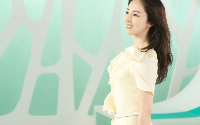 Woman yellow dress smiling wall #2 free wallpaper - medium preview image