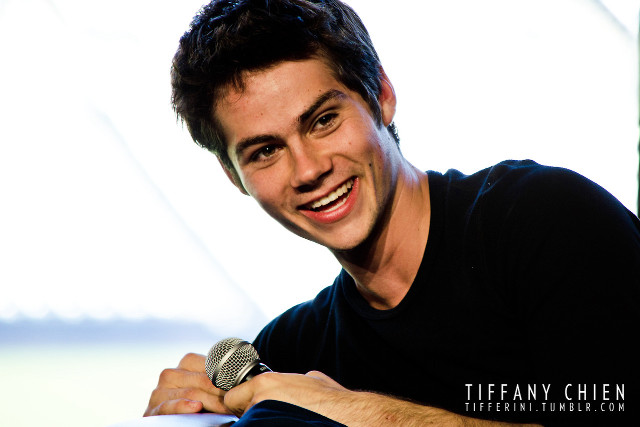 Man holding microphone smiling white free wallpaper - medium preview image