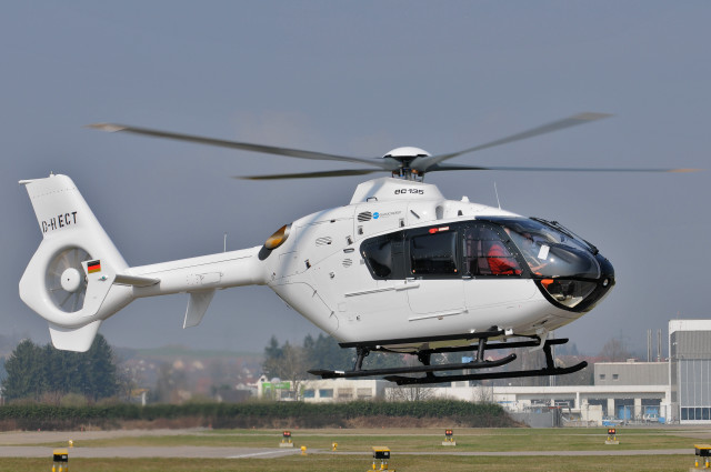 Helicopter flying low field building free wallpaper - medium preview image