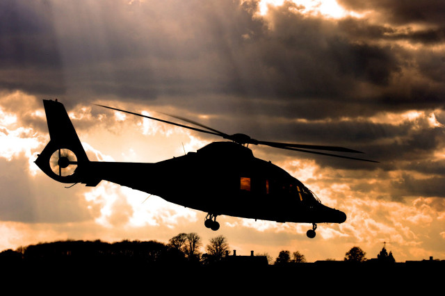 Helicopter flying cloudy sky sunbeams free wallpaper - medium preview image
