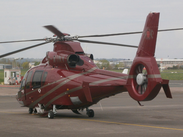 Red helicopter airport tarmac sky free wallpaper - medium preview image