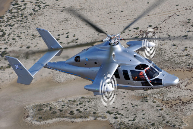 Helicopter flying sandy area sky free wallpaper - medium preview image