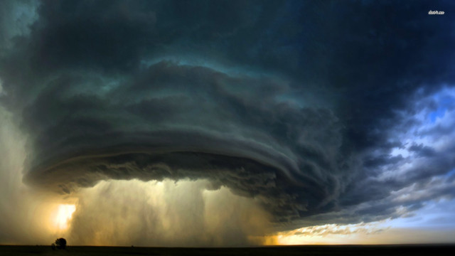 Storm cloud field tractor blue free wallpaper - medium preview image