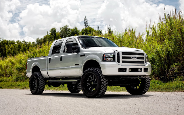 White truck parked road forest free wallpaper - medium preview image