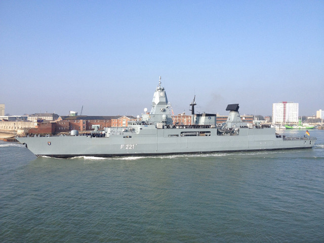 Large gray ship sailing city free wallpaper - medium preview image