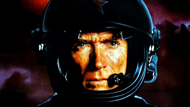 Man helmet mustache staring camera free wallpaper - medium preview image