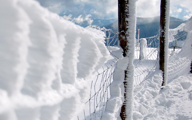 Fence covered snow piled mountain free wallpaper - medium preview image