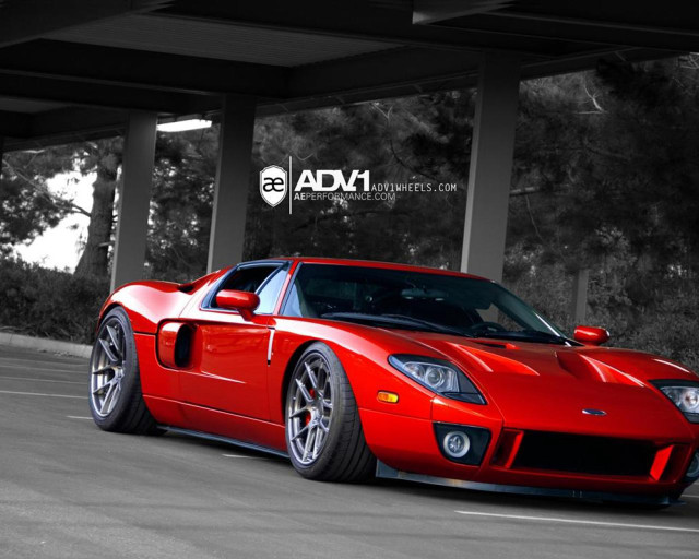 Red sports car parking lot #12 free wallpaper - medium preview image