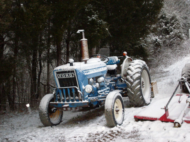 Tractor parked snow man snow free wallpaper - medium preview image
