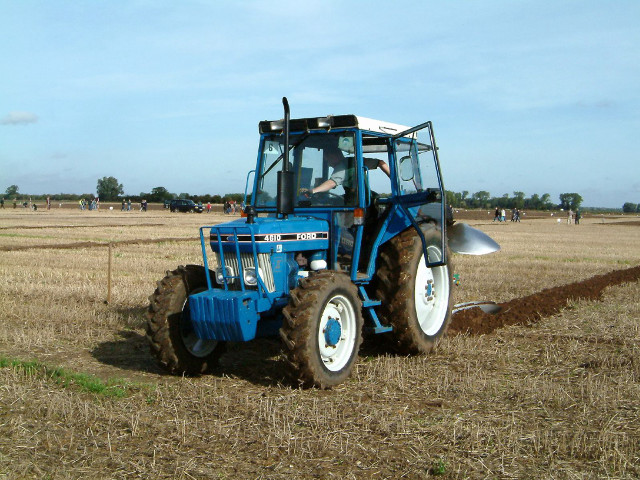Blue tractor field sky people free wallpaper - medium preview image
