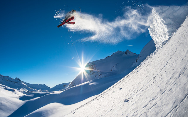 Snowboarder snowy mountain slope sunlight free wallpaper - medium preview image