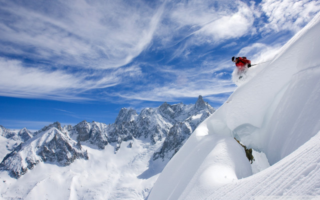 Person skis jumping snowy mountain free wallpaper - medium preview image